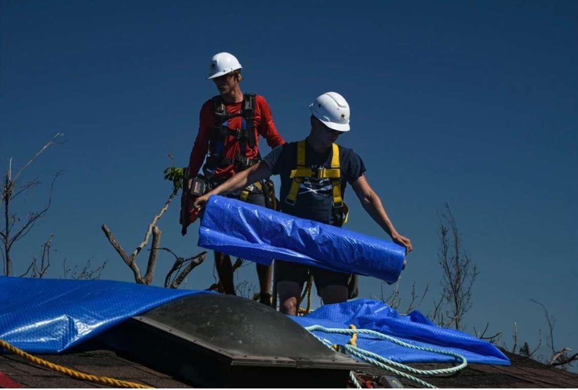 The crew on a large storm-repair job, the scale of work that often runs through subcontracting.