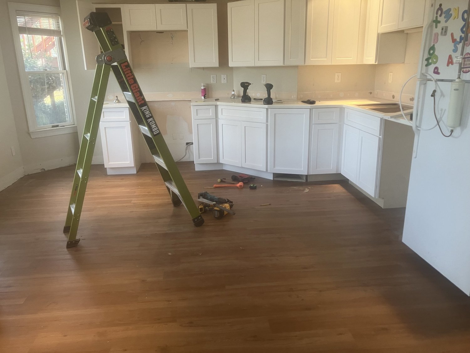 New flooring in a kitchen, still in the last day of the install.