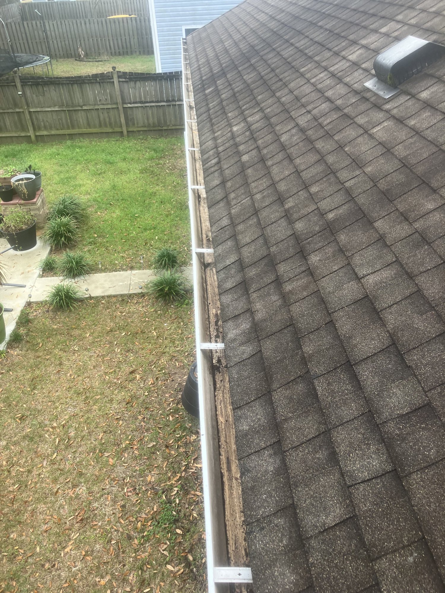 A cleaned gutter line after a roof visit.