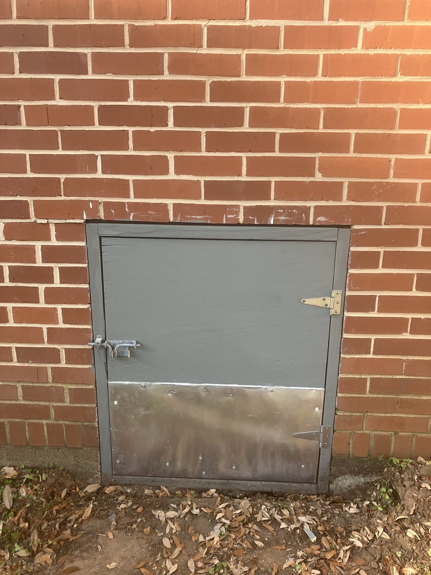 A new utility door set into a brick wall.